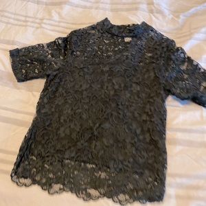 A short sleeve long crop lace shirt.
